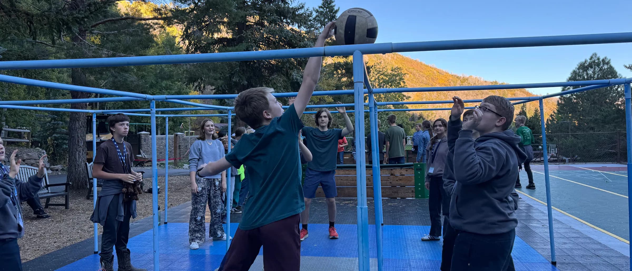 Students playing on the outdoor court at Aspen Grove during Youth Conference